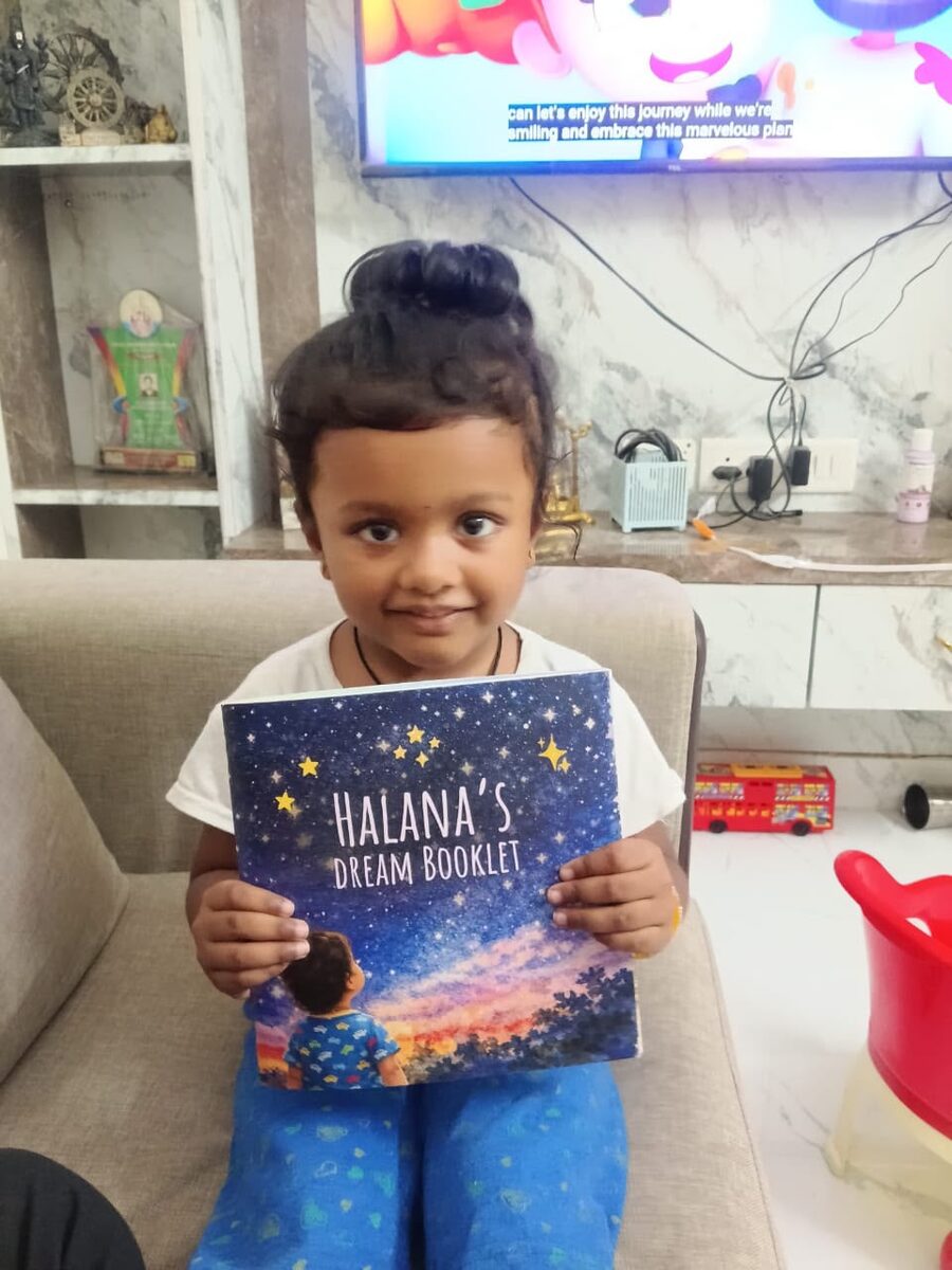 Halana holding her own DreamBooklet