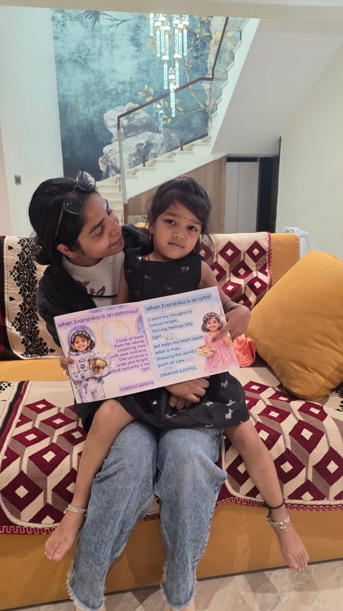 Ivanshika with co-founder Ayousha Tiwari, reading the astronaut and artist spread